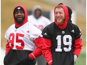 Stampeders DL Davis Ja'Gared (L) and QB Bo Levi Mitchell share laughs with teammates during CFL practice in Calgary, Alta. on Saturday November 19, 2016. The Calgary Stampeders play the BC Lions in the CFL Western Final on Sunday at McMahon Stadium in Calgary.