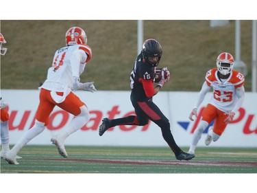 Calgary Stampeders Marquay McDaniel avoids a tackle by Mike Edem of the BC Lions during 2016 CFLís West Division Final in Calgary, Alta., on Sunday, November 20, 2016. AL CHAREST/POSTMEDIA