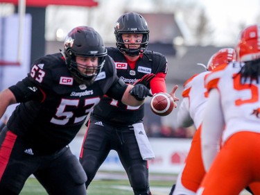 Bo Levi Mitchell takes the snap against the BC Lions in Western Final CFL action