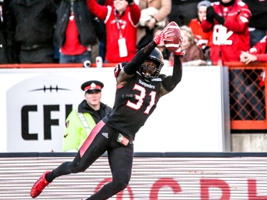 Calgary Stampeders Brandon McDonald dives into the end zone for a touchdown after an interception against the BC Lions in Western Final CFL action at McMahon Stadium in Calgary, Alta.. on Sunday November 20, 2016. Mike Drew/Postmedia