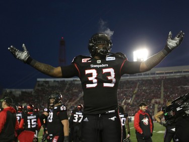 Calgary Stampeders Jerome Messam gets the crowd going during their game against the BC Lions in CFL Western Final action at McMahon Stadium in Calgary, Alta.. on Sunday November 20, 2016. Leah hennel/Postmedia