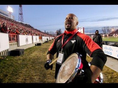 Former Stampeders star Jon Cornish urges on the Calgary Stampeders fans from the sidelines against the BC Lions in Western Final CFL action at McMahon Stadium in Calgary, Alta.. on Sunday November 20, 2016. The Stamps beat the Lions 42-15. Mike Drew/Postmedia