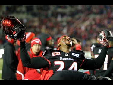 Calgary Stampeders Joe Burnett celebrates their win against the BC Lions during Western Final CFL action at McMahon Stadium in Calgary, Alta.. on Sunday November 20, 2016. Leah hennel/Postmedia
