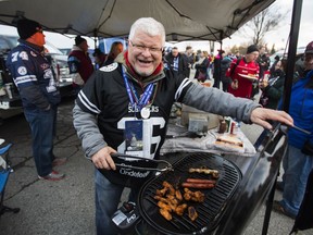 Stephen Kay at the grill at the Grey Cup tailgate party at the parking lot of Ontario Place across the road from BMO Field in Toronto, Ont.  on Sunday November 27, 2016. Ernest Doroszuk/Toronto Sun/Postmedia Network