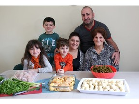 Syrian refugees George Darmo, his wife Nasma and his mother Awikel with their children David, 11, Ralph, 4, and Kailen, 8. They are among the 917 refugees privately sponsored by the Calgary Catholic Immigration Society in 2016.