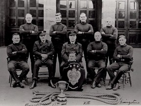 The Pomp & Circumstance exhibit at Lougheed House includes this photo of the winning fire department tug of war team in 1893.