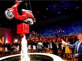 Tossing coins in the Vespa Fountain at Building Hope for Kids - A Night in Italy at the Telus Convention Centre. The event held in October raised more than $165,000 for the Alberta Children's Hospital.