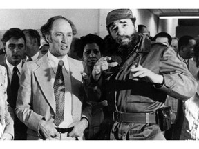 Prime Minister Pierre Elliott Trudeau looks on as Cuban President Fidel Castro gestures during a visit in Havana in 1976.