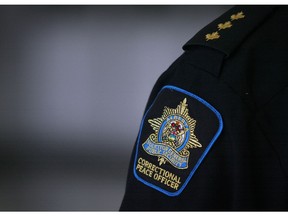 A correctional officer stands watch at the Calgary Correctional Centre in Calgary, Alberta Wednesday, October 20, 2010. (Stuart Gradon/Calgary Herald)