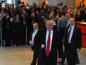 US President-elect Donald Trump leaves after a meeting at the New York Times on November 22, 2016 in New York. US President-elect Trump on Tuesday disavowed the white nationalist "alt-right" movement that has cheered his election, saying he did not want to "energize" them."I condemn them. I disavow, and I condemn," Trump was quoted as saying in an interview with The New York Times, when pressed to comment on a conference at which his victory was celebrated with rousing Nazi salutes.    /