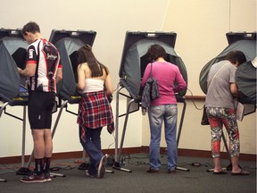 Voters cast their votes a day early at the City Hall in Irvine, Calif., Monday, Nov. 7, 2016. (Mindy Schauer/The Orange County Register via AP) ORG XMIT: CAANR102