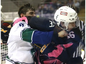 Walker Cote, right, of the Grande Prairie Storm, and Jordan McConnell, of the Calgary Canucks, scuffle after the whistle in Alberta Junior Hockey League action on Saturday October 22, 2016 at Revolution Place in Grande Prairie, Alta. The Canucks won 4-3 in overtime. Logan Clow/Grande Prairie Daily Herald-Tribune/Postmedia Network