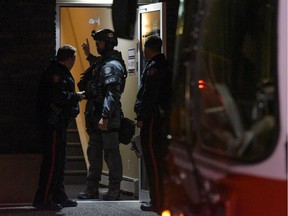 Police move into a condominium complex in NE Calgary during a police situation on Saturday, Nov. 12, 2016.