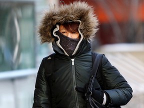 A women bundles up against the frigid temperatures in Calgary