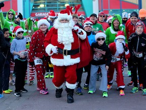 Santa gets ready to run during the Salvation Army Santa Shuffle Fun Run and Elf Walk in Calgary, Alta., on Saturday, December 3, 2016. Leah Hennel/Postmedia