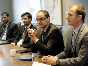 Alberta Finance Minister Joe Ceci, second right, met with top economic experts on Wednesday to discuss economic forecasts for 2017.