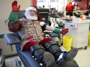 Santa gives his 200th blood donation at Canadian Blood Services in Calgary, Alta., on Friday December 9, 2016. Leah Hennel/Postmedia