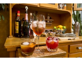 A Chocolate Orange, Rose Rosa RosŽ, and a cranberry gin and tonic line the home bar of Calgary Herald Drinks writer Lisa Kadane in Calgary, Alta., on Thursday, Dec. 1, 2016. Lyle Aspinall/Postmedia Network