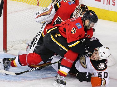 Calgary Flames captain Mark Giordano puts the pressure on the Anaheim Mighty Ducks' Antoine Vermette after the Ducks scored on a third period power play at the Scotiabank Saddledome in Calgary on Thursday December 29, 2016.