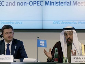 Russian Minister of Energy Alexander Novak, left, and Khalid Al-Falih, Minister of Energy, Industry and Mineral Resources of Saudi Arabia attend a news conference after a meeting of the Organization of the Petroleum Exporting Countries, OPEC, at their headquarters in Vienna, Austria, Saturday, Dec. 10, 2016. (AP Photo/Ronald Zak) ORG XMIT: XRZ119