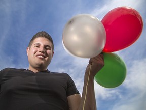 Daniel Boria, the CEO of All Natural Clean whom rode a lawn chair with helium balloons to 5,000 feet over downtown, poses at his business in Calgary on Monday, July 6, 2015.