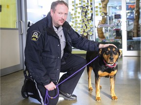 Brad Nichols, Senior Manager, Animal Cruelty Investigations poses in a supplied photo from the Calgary Humane Society shows a dog recently seized/ rescued during the cold snap. With the extreme cold forecasted for the next several days, officials are reminding pet owners to be vigilant when leaving their animals outdoors. In just the past few days, several warnings have been issued and pets have been seized due to being left outdoors without adequate food, water or shelter from the elements. Courtesy Calgary Humane Society/Postmedia