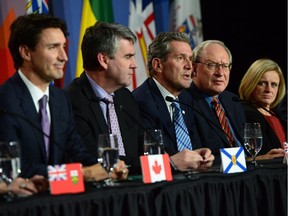 Manitoba Premier Brian Pallister, centre, talks as Prime Minister Justin Trudeau, left to right, Nova Scotia Premier Stephen McNeil, Prince Edward Island Premier Wade MacLauchlan and Alberta Premier Rachel Notley look on during the closing press conference of the Meeting of First Ministers and National Indigenous Leaders in Ottawa on Friday, Dec. 9, 2016.