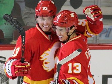 Calgary Flames Sam Bennett, left and Johnny Gaudreau celebrate Bennett's goal on the Winnipeg Jets during the second period of NHL action at the Scotiabank Saddledome in Calgary on Saturday December 10, 2016. Gaudreau assisted on the goal.