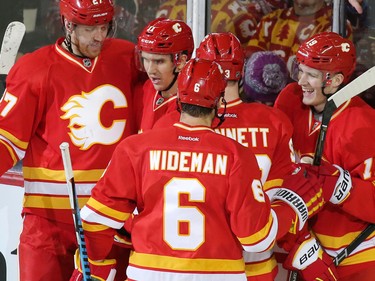Calgary Flames celebrate Mikael Backlund goal  against the Winnipeg Jets during the second period of NHL action at the Scotiabank Saddledome in Calgary on Saturday December 10, 2016.