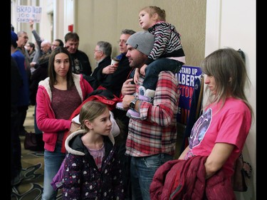 The Huber family wait for the start of a large anti carbon tax rally held at the Westin Hotel in Calgary on Sunday December 11, 2016.