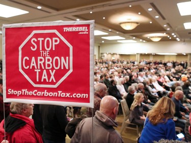 A large crowd listens to Ezra Levant speak during Rebel Media's anti carbon tax rally held at the Westin Hotel in Calgary on Sunday December 11, 2016.