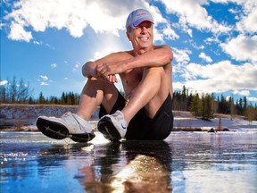 Bernie Potvin, one of the "Old Guys in Action," poses in his swim trucks on the ice of a pond at Elbow Valley Estates where the 2017 New Year 's Day Icebreaker Dip will take place. The annual event raises money for Servants Anonymous.