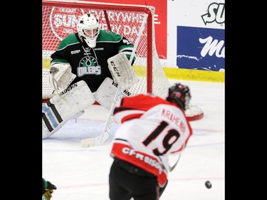 The CFR Chemical Bisons' Joel Krahenbil gets a shot off on Alaska Oilers goaltender Jack Walters in the 2016-17 Mac's Midget Hockey Tournament game at the Max Bell Arenas on Tuesday December 27, 2016.