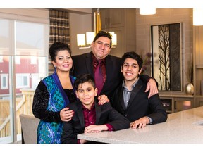 Sukhbans and Anita Jakhu, with Abhi, 16, and Shan, 11, in a show home in Cityscape.