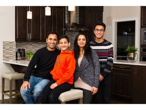 Jasvir Singh Kreer and Anju Bala Kreer with their children Navjot and Jasjot in an Excel Homes show home in Carrington.