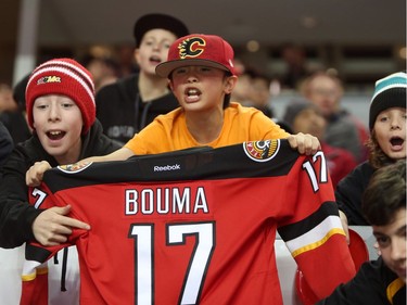 Calgary Flames fans cheers on their favourite player during the Flames SuperSkills at the Scotiabank Saddledomein Calgary, Alta., on Saturday December 3, 2016. Leah Hennel/Postmedia
