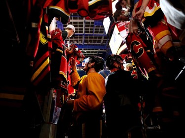 Calgary Flames Lance Bouma, left, signs autographs during the Flames SuperSkills at the Scotiabank Saddledomein Calgary, Alta., on Saturday December 3, 2016. Leah Hennel/Postmedia