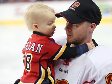 Calgary Flames Matt Stajan holds his 20 month old son, Elliot, during the Flames SuperSkills at the Scotiabank Saddledomein Calgary, Alta., on Saturday December 3, 2016. Leah Hennel/Postmedia