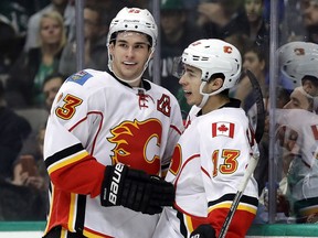 DALLAS, TX - DECEMBER 06:  Sean Monahan #23 and Johnny Gaudreau #13 of the Calgary Flames celebrate a goal against the Dallas Stars in the second period at American Airlines Center on December 6, 2016 in Dallas, Texas.