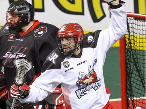 Calgary Roughnecks Wesley Berg celebrates a goal in front of Vancouver Stealth goalie Eric Penney in NLL action at the Scotiabank Saddledome in Calgary, Alta. on Saturday January 30, 2016. Mike Drew/Postmedia