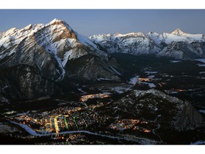 Caption: View of Banff at dusk from the upper terminal at the Banff Gondola.