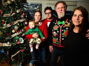 A real-life Grinch is on the loose after (left) Andrea Muhlbach, her son Hunter and husband Kyle with Andrea's parents David and Cheryl Todd woke up Christmas morning to David Todd's truck, many wallets and a bunch of Christmas presents all stolen from the southwest Calgary home on Dec. 25.