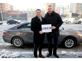 Evan Woolley, left, and Uber driver Mike Commodore, former Calgary Flame, at the launch of Uber in Calgary on Dec. 6, 2016.