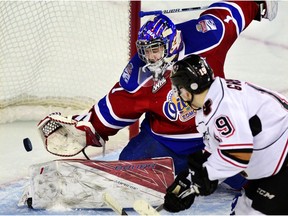 Calgary Hitmen's Andrei Grishakov scored the game-tying goal on Edmonton Oil Kings goalie Patrick Dea at the Saddledome in the first of a home and away series on Friday, Dec. 30. (Ryan McLeod)