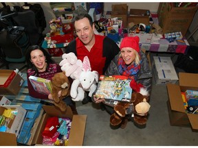 FILE PHOTO: L to R —Janeen Webb, Director, Donor Relations, Inn from the Cold, Clayton Busher, Vice President, The Magic of Christmas and Nadine Gariepy-Fisk, Director, Child and Family Grief Services, Hospice Calgary pose in Calgary, AB.