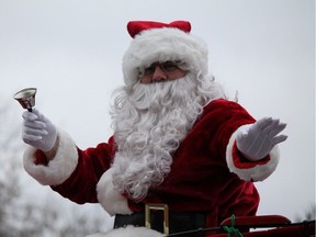 J. Seaborn/For The Community Press The man of the hour, Santa Claus himself, waves to the crowd assembled to watch the annual parade in Marmora last Saturday.