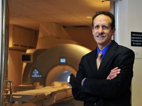 FILE Photo supplied by Alberta Health Services shows Mauro Chies, Vice-President, Diagnostic Imaging, Edmonton Zone of Alberta Health Services in front of a magnetic resonance imaging scanner (MRI) at the University of Alberta Hospital.  Photo supplied by Alberta Health Services