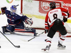 Moose Jaw Generals net minder Matt Lenz stops a shot from CFR Chemical Bisons' Brandon Machado as the Mac's AAA Midget tournament continued on Friday, Dec. 30, 2016. (Leah Hennel)