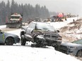 Multiple vechicles are shown on the side of Highway 1 west of Calgary, Alta following a multiple vehicle accident near Scott Lake Hill on Friday December 23, 2016. The incident snarled holiday traffic hours as travellers and commuted hit the highway. Jim Wells/Postmedia