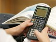 OTTAWA 03/21/07 - Sam Stevenson (not pictured) with the TI-83 Plus graphing calculator. Anne Leach's academic math class uses the TI-83 Plus graphing calculator. St. Michael Catholic High School in Kemptville. For Fraser Institute high school rankings story. Photo by MIKE CARROCCETTO, THE OTTAWA CITIZEN (for CITY story by MARIA KUBACKI) NEG# 82839
study homework textbook student